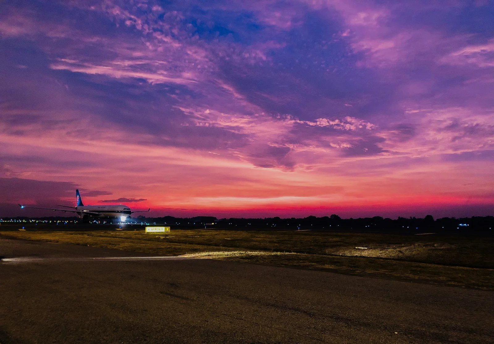 Aircraft on the apron at Bandaranaike International Airport, Sri Lanka, at sunset.